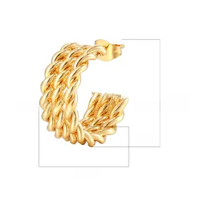 Detail showing 21mm twisted gold hoop earrings in 18K gold plated stainless steel