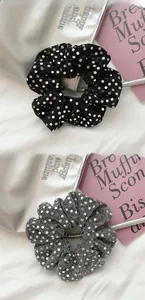 Close-up of glitter sequins scrunchies with polka dot patterns on soft fur background