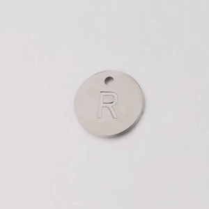 Polished stainless steel 12mm round charm pendant featuring an engraved letter R