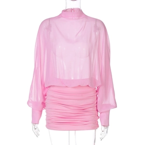 Detail of pink sheer mesh long-sleeve top and matching ruched mini skirt set