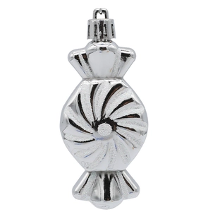 Close-up of a silver candy-shaped Christmas ornament with glittery texture and shiny finish