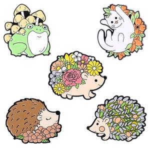 Five-piece set of cartoon enamel pins featuring cute cats, frogs and hedgehogs with flowers