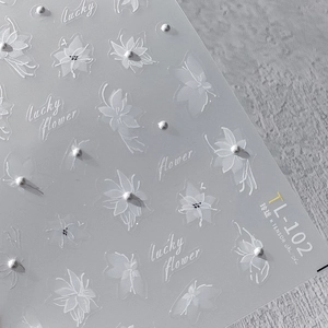 3D floral nail stickers TL-102 with pearl accents and lucky flower design on gray background