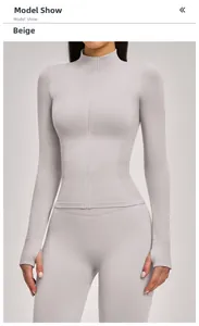 Close-up of white sand yoga jacket with stand collar, full zipper, and thumbholes