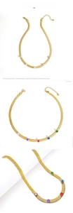 Detail of gold snake bone chain necklace with colorful round cut cubic zirconia stones