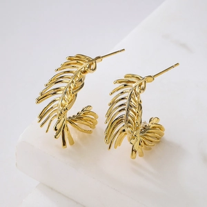 Irregular feather-shaped 18K gold plated copper earrings in a minimalist hoop style