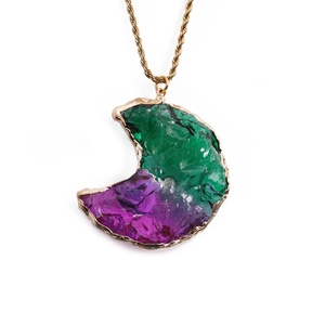 Gold twist chain necklace with a crescent moon green and purple crystal pendant