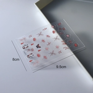 Detail of waterproof 3D embossed nail stickers with red spider lily and cat designs
