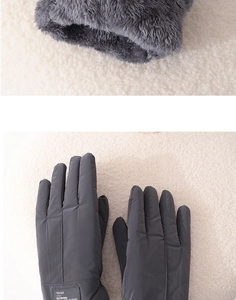 Close-up of thick grey fleece lining and waterproof fabric on men's winter gloves