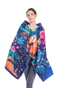 Microfiber beach towel with cartoon sloth and tropical leaf print shown on model