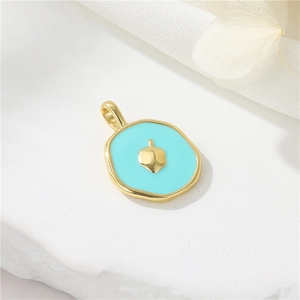 Detail of 14K gold plated pendant with light blue enamel and central golden drop accent