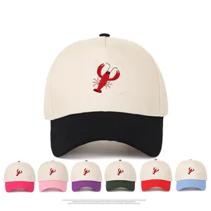 Two-tone cotton baseball cap with lobster embroidery shown in seven color options