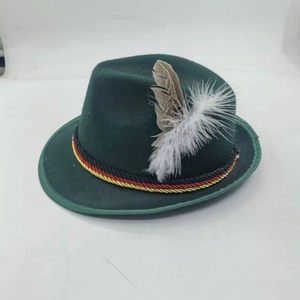 Detail of dark green Tyrolean hat featuring tricolor cord and natural feather ornament