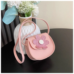Pink PU leather girls crossbody bag featuring a large sequin flower and a long shoulder strap