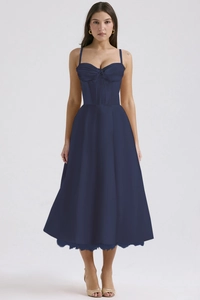 Detail of navy blue floral midi dress with spaghetti straps and ruched bust design
