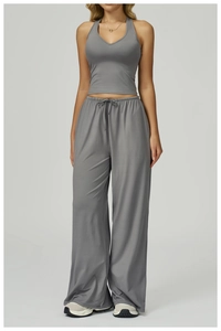 Detail of grey yoga set featuring a halter slim vest and high-waist drawstring wide-leg pants