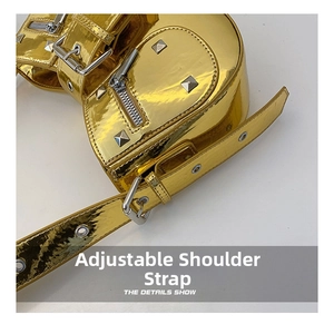 Detail of metallic gold shoulder bag featuring adjustable strap and square rivets