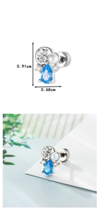 Macro detail showing dimensions of blue teardrop zircon conch ear stud with pearl accent