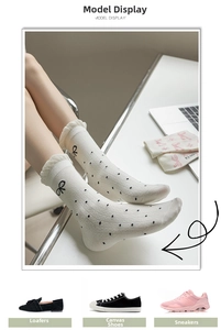 Detail of cream ruffle trim socks with black polka dots and delicate bow pattern