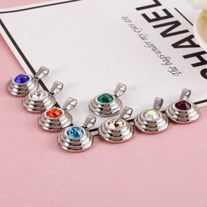 Set of eight round stainless steel pendants featuring colorful cubic zirconia stones