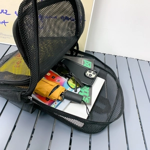 Breathable black mesh backpack for beach and gym showing large storage capacity