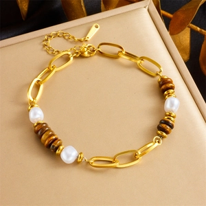 Gold stainless steel link bracelet with white pearls and oval tiger eye stone charm