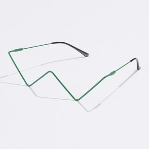 Detail of green minimalist geometric metal eyeglass frame with sharp V-shaped design lines