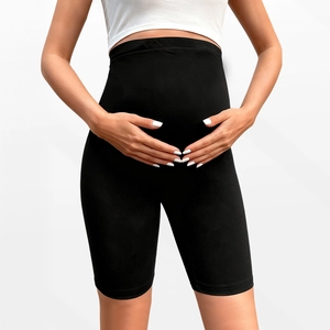 Detail of high waisted maternity shorts showing the supportive belly band and soft cotton fabric