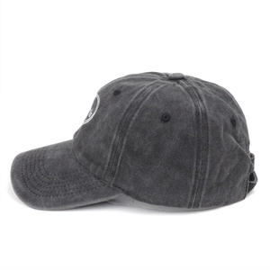 Close-up of charcoal gray washed cotton baseball cap with white heart embroidery details