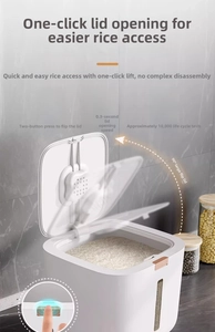 Detail of white airtight rice container with 90-degree flip lid and gold press button