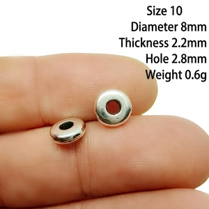 Close-up of 8mm silver alloy spacer bead showing 2.8mm hole diameter and 2.2mm thickness