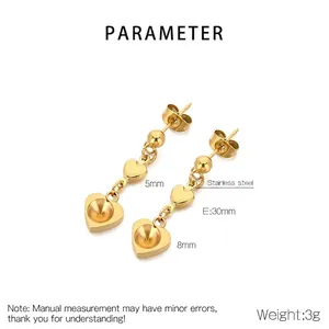 Detailed view of gold stainless steel double heart tassel earrings with dimensions
