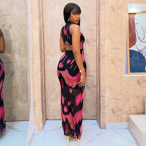 Pink and black abstract print sleeveless maxi dress with high neck and backless cutout design