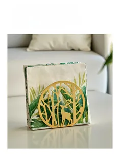 Detail of golden iron napkin holder featuring an intricate forest elk cutout design