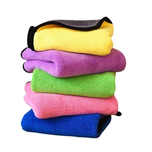 Five pieces of thick microfiber cleaning cloths in vibrant colors with black edge binding