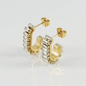 Detailed macro shot of French retro C-shaped earrings with rectangular cubic zirconia