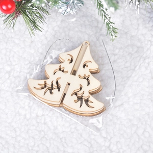 DIY 3D wooden Christmas tree ornament in natural wood finish with silver hanging string