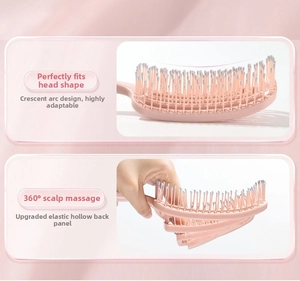 Detail of pink flexible curved vent brush showing 360-degree scalp massage bristle tips