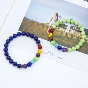 Detail of natural tiger eye and chakra yoga beads with blue lapis and marble green finish