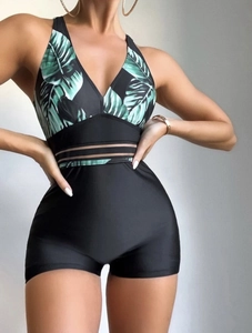 Detail view of tropical leaf print swimsuit with semi-transparent mesh waist stripes