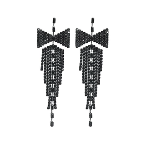 Detailed close-up of elegant black bow drop earrings featuring long rhinestone tassels