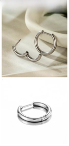 Detailed view of silver G23 titanium hoop earrings with hinged clicker closure mechanism