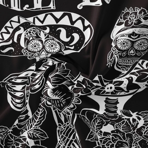Macro detail of Bohemian sugar skull tapestry fabric showing soft texture and printing