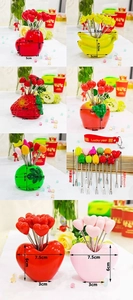 Close-up of heart-shaped base and stainless steel fruit forks with strawberry toppers