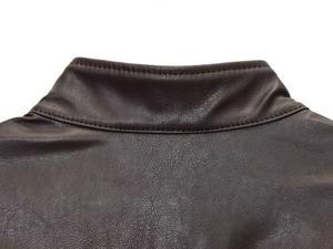 Detailed close-up of dark brown leather jacket collar with premium double stitching