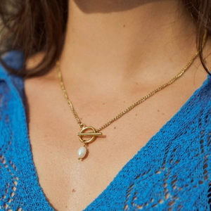 18k gold plated T-bar toggle necklace with pearl pendant shown on neck