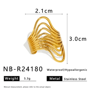 Macro detail of gold irregular wavy ring showing size, weight, and stainless steel specs