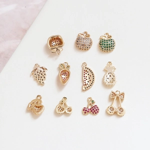 Detailed view of assorted fruit pendants with gold plating and colorful zircons