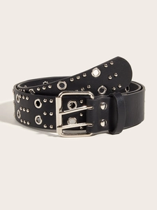Detailed view of punk style black leather belt featuring double grommets and silver metal studs