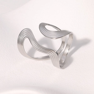 Minimalist silver wavy layered stainless steel ring with a brushed metal texture